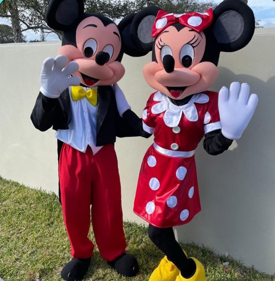 Mickey and Minnie Mouse characters at a party